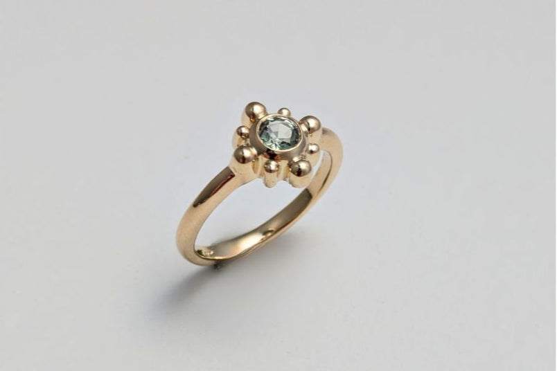 Gold ring with an alexandrite gemstone